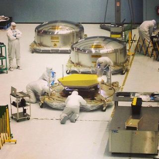 One of the last three flight primary mirror segments of the James Webb Space Telescope are inspected after delivery to NASA Goddard.