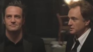 Matthew Perry and Bradley Whitford standing around taking in the set in Studio 60 on the Sunset Strip.