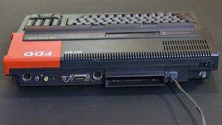 The rear of the Sony HB-FX1D. From left to right: RGB out, RF out, composite audio out, composite video out, RF channel select, parallel port, cassette recorder connector, and second cartridge port. On the left of the unit in this photo is the 720k 3.5" floppy disk drive and two controller (for joystick/gamepad, mouse, paddles, etc.) ports.