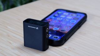 Sennheiser Profile Wireless microphone receiver attached to iPhone 13