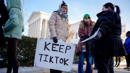 Woman holding Tiktok placard