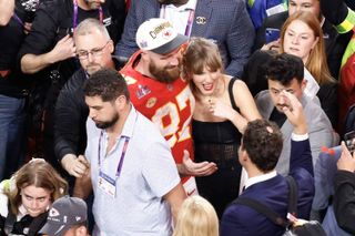 Taylor swift at the super bowl wearing a corset top