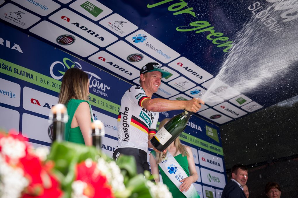 Pascal Ackermann celebrates on the podium after winning the opening stage at the Tour of Slovenia
