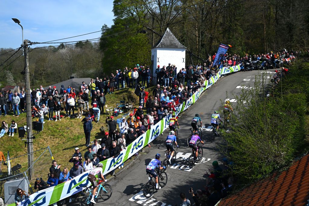 HUY BELGIUM APRIL 19 Daryl Impey of South Africa and Team Israel Premier Tech Lawrence Naesen of Belgium and AG2R Citron Team Georg Zimmermann of Germany and Team Intermarch Circus Wanty Jacob Hindsgaul of Denmark and UnoX Pro Cycling Team Sren Kragh Andersen of Denmark and Team AlpecinDeceuninck Ral Garca Pierna of Spain and Team Equipo Kern Pharma Johan Meens of Belgium and Team Bingoal WB and Jetse Bol of The Netherlands and Team BurgosBH compete in the breakaway climbing to the Cte de Cherav 195m while fans cheer during the 87th La Fleche Wallonne 2023 Mens Elite a 1943km one day race from Herve to Mur de Huy UCIWT on April 19 2023 in Huy Belgium Photo by Luc ClaessenGetty Images