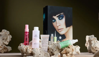 Photo of Glossybox products on rocks next to box