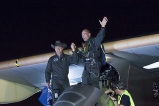 Solar Impulse founders Bertrand Piccard (in pilot seat) and André Borschberg in Phoenix at the end of the first leg of the solar plane's historic cross-country trip.