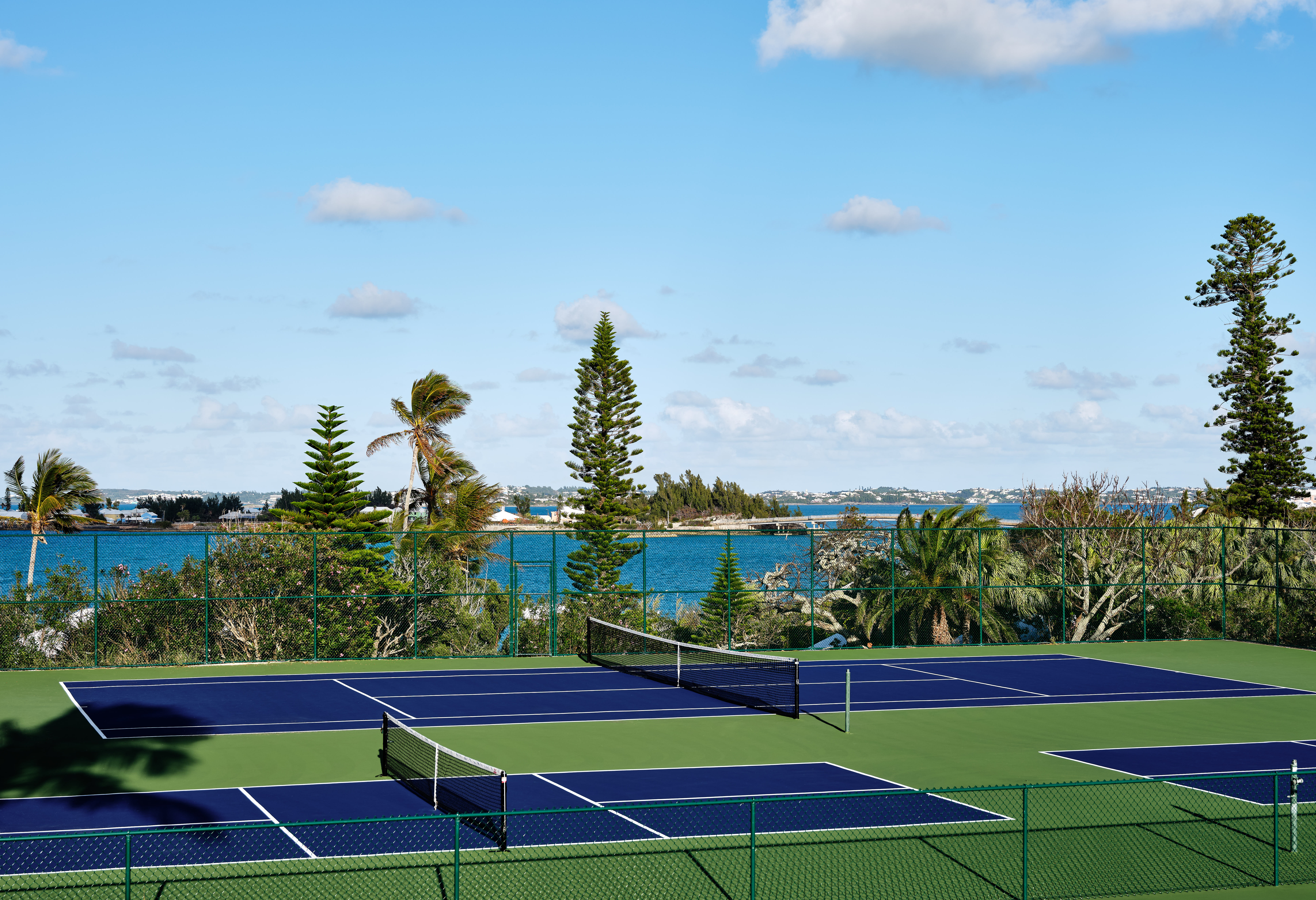 The blue and green tennis courts at Cambridge Beaches