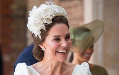 Catherine Duchess of Cambridge carries Prince Louis