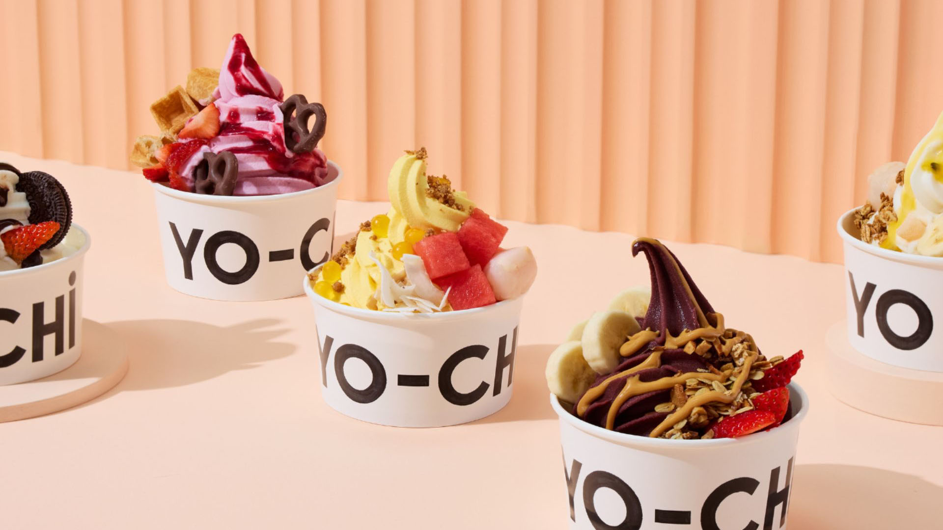 An image of some frozen yoghurt pots.
