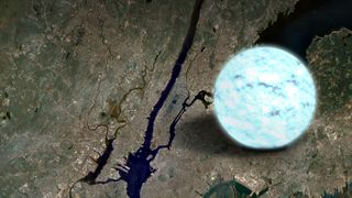 light blue glowing orb atop a satellite image of Manhattan and its surroundings