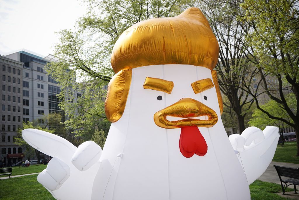 An inflatable chicken that looks like President Trump.