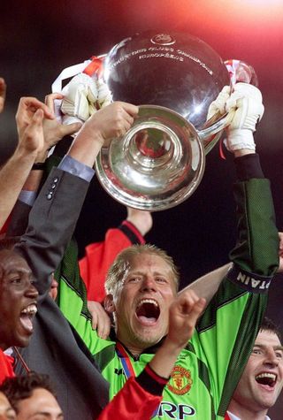 Peter Schmeichel lifts the Champions League aloft (Phil Noble/PA)