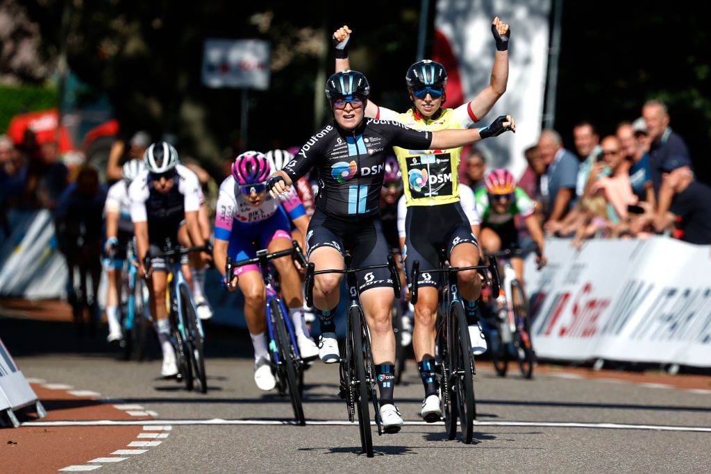 GENNEP NETHERLANDS SEPTEMBER 01 Charlotte Kool of Netherlands and Team DSM celebrates at finish line as stage winner Georgia Baker of Australia and Team BikeExchange Jayco and Lorena Wiebes of Netherlands and Team DSM Yellow leader jersey during the 25th Simac Ladies Tour 2022 Stage 3 a 1391km stage from Gennep to Gennep SLT2022 UCIWWT on September 01 2022 in Gennep Netherlands Photo by Bas CzerwinskiGetty Images
