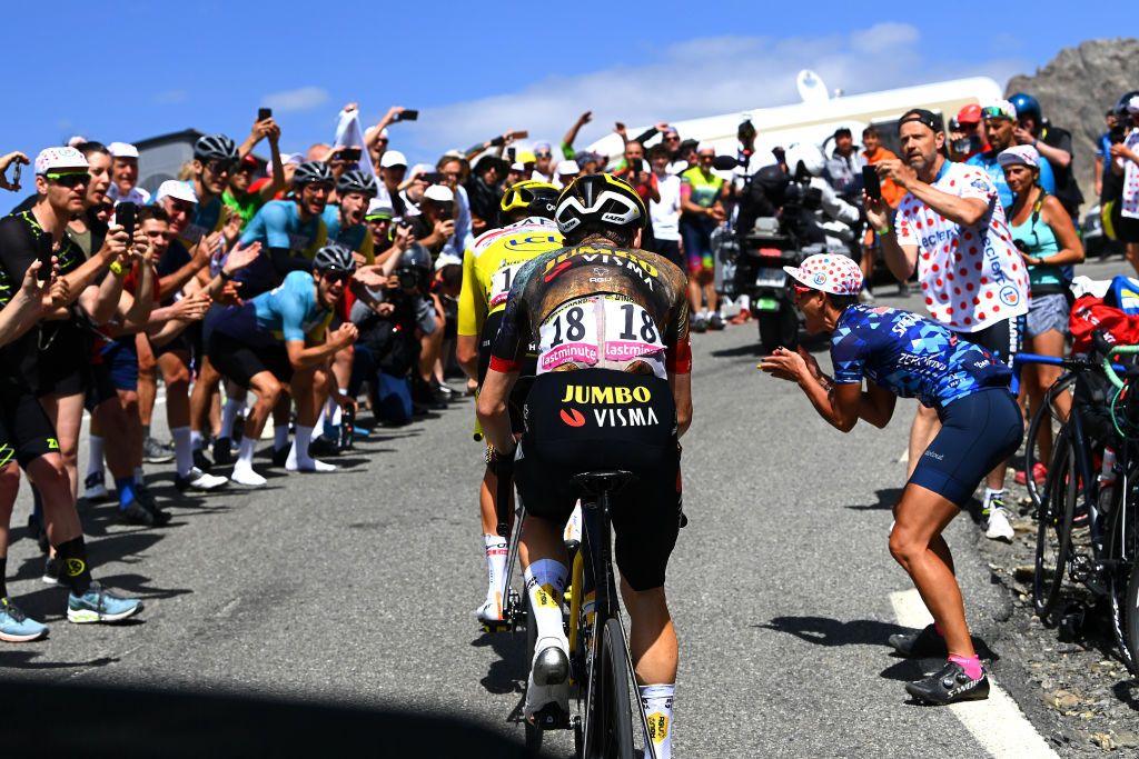 SERRE CHEVALIER FRANCE JULY 13 LR Tadej Pogacar of Slovenia and UAE Team Emirates Yellow Leader Jersey and Jonas Vingegaard Rasmussen of Denmark and Team Jumbo Visma compete in the chase group at Col du Galibier 2630m while fans cheer during the 109th Tour de France 2022 Stage 11 a 1517km stage from Albertville to Col de Granon Serre Chevalier 2404m TDF2022 WorldTour on July 13 2022 in Col de GranonSerre Chevalier France Photo by Tim de WaeleGetty Images