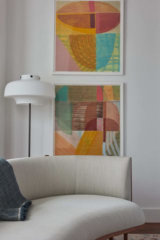 Art in the living room was chosen by Studio Nato and helped introduce a color palette
