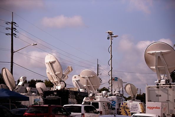 Media trucks outside the Pulse Nightclub in Orlando after a mass shooting.