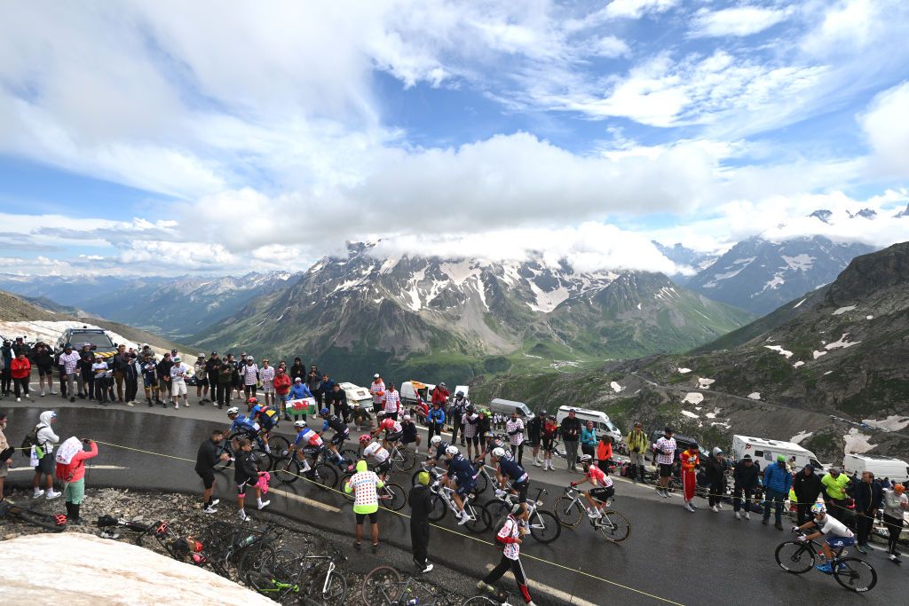 VALLOIRE FRANCE JULY 02 LR Oliver Naesen of Belgium Paul Lapeira of France and Decathlon AG2R La Mondiale Team Ion Izagirre Insausti of Spain and Team Cofidis Rui Costa of Portugal and Team EF Education EasyPost Quentin Pacher of France Stefan Kung of Switzerland and Team Groupama FDJ and a general view of the peloton climbing to the Col du Galibier 2642m during the 111th Tour de France 2024 Stage 4 a 1394km stage from Pinerolo to Valloire UCIWT on July 02 2024 in Valloire France Photo by Dario BelingheriGetty Images