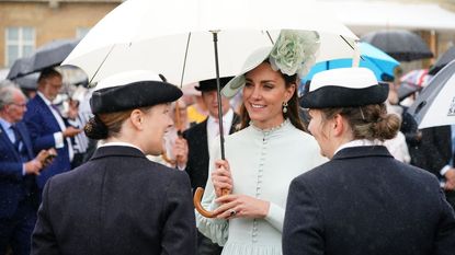 Catherine, Duchess of Cambridge speaks to guests during a Royal Garden Party at Buckingham Palace on May 25, 2022 in London, England