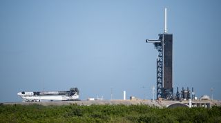 The SpaceX Falcon 9 rocket and Dragon capsule for the Crew-4 astronaut mission roll out to their launch pad at Kennedy Space Center in Florida on April 19, 2022.