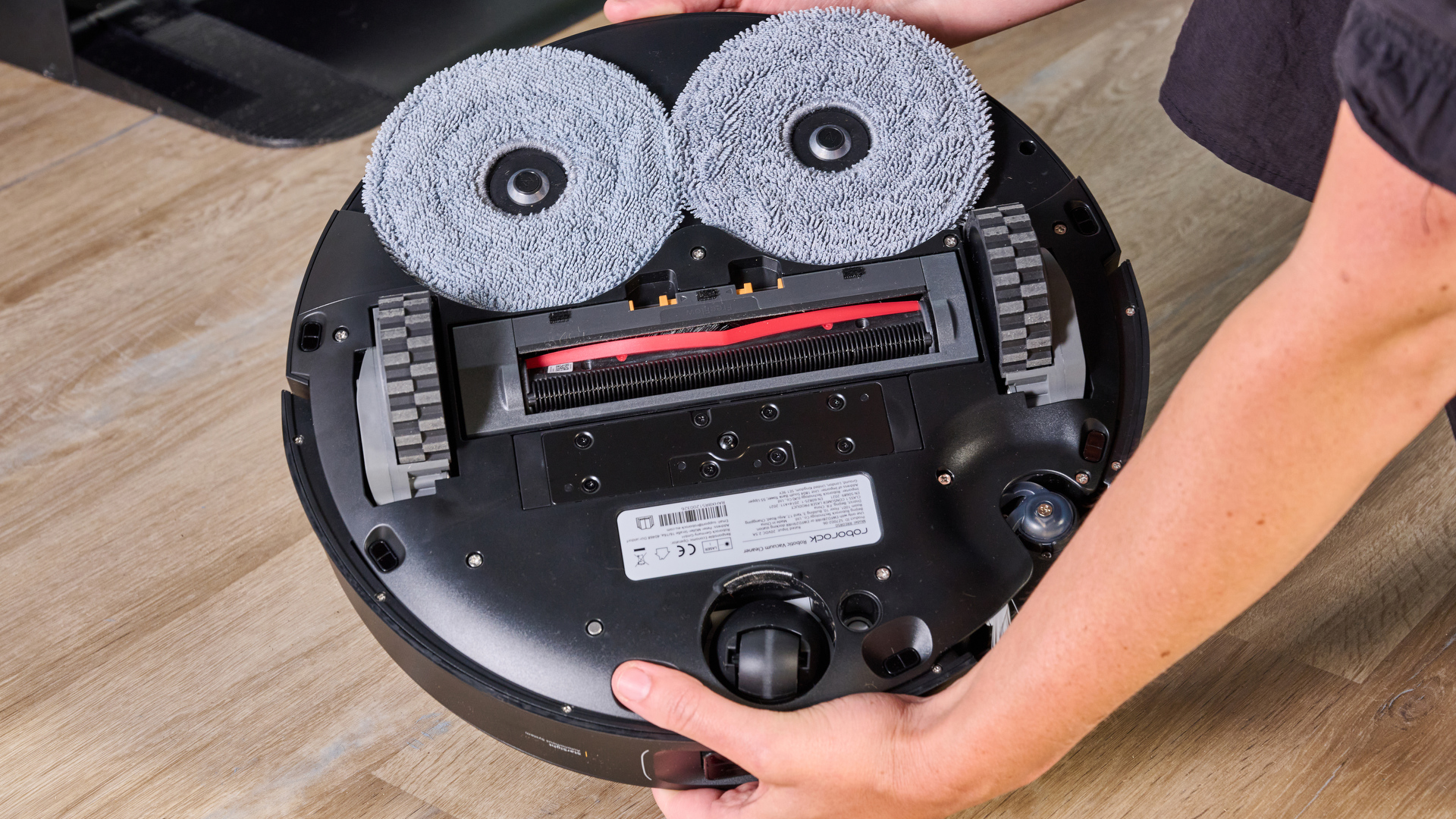 Roborock Saros Z70 robot vacuum flipped over to show the underside