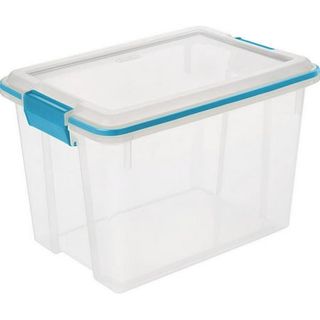 A large clear plastic storage bin with blue clips holding the lid on. white background