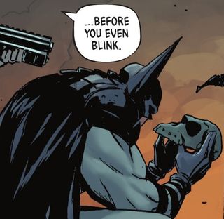 Batman studies a mask.