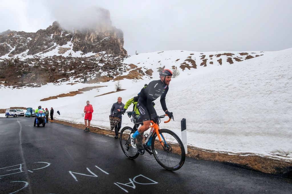 Bahrain Victorious&#039; Damiano Caruso ascends Passo Giau on stage 16 and rides into second overall