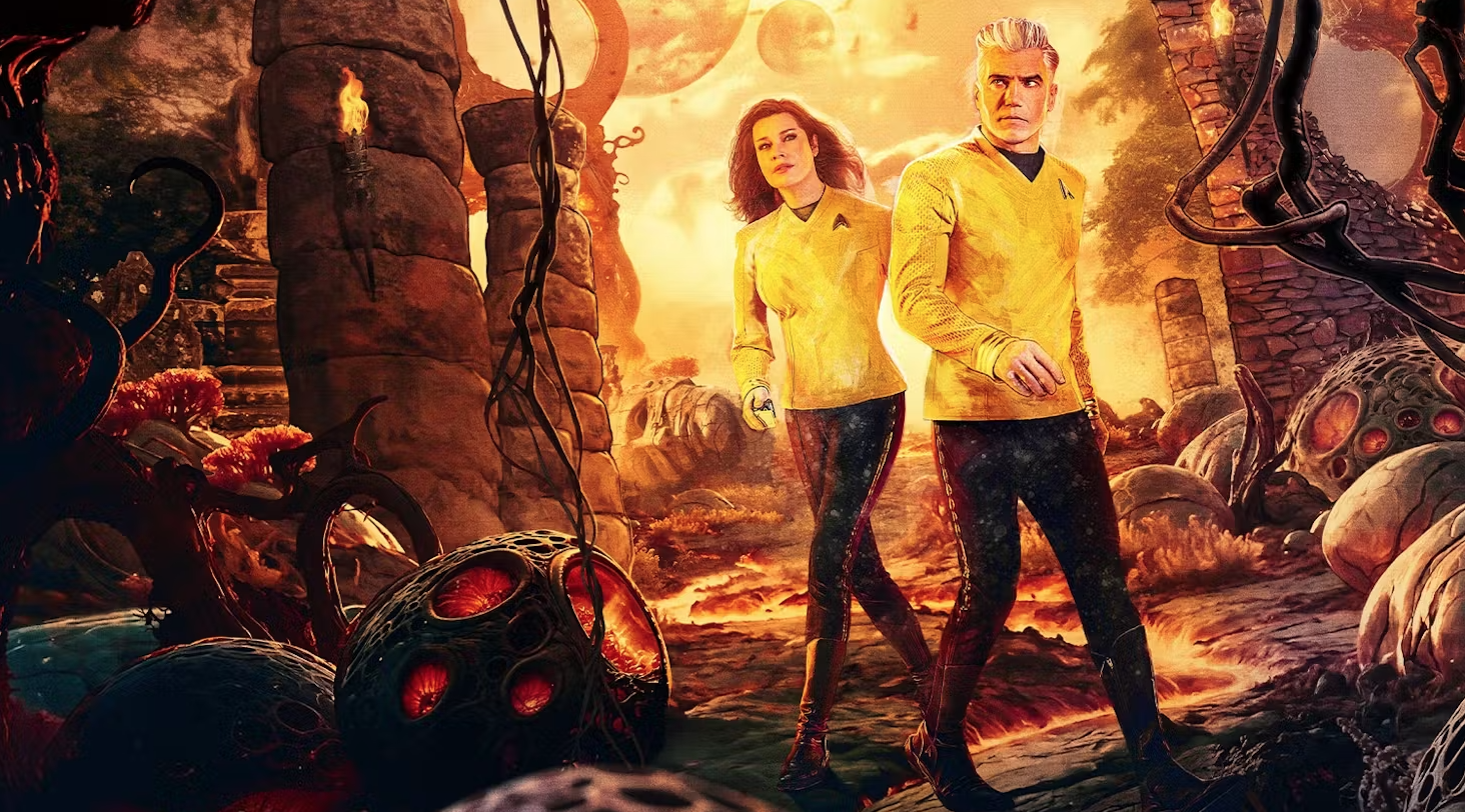 two sci-fi figures in yellow uniforms in an alien environment