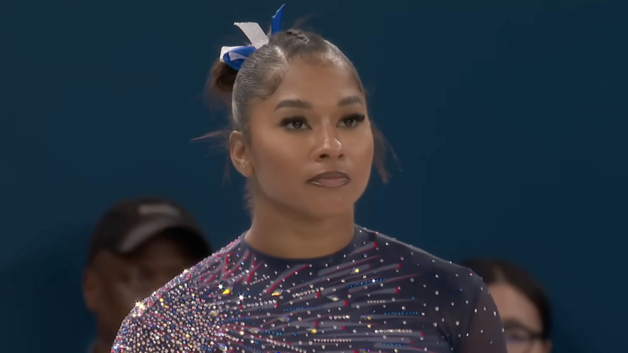 Jordan Chiles preparing for an uneven bars routine at the 2024 Paris Olympics.