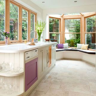 kitchen with glass windows and white flooring