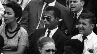 James Baldwin in a crowd in I Am Not Your Negro