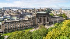A view over Edinburgh with St Andrew's House, home of the Scottish Parliament, in the foreground