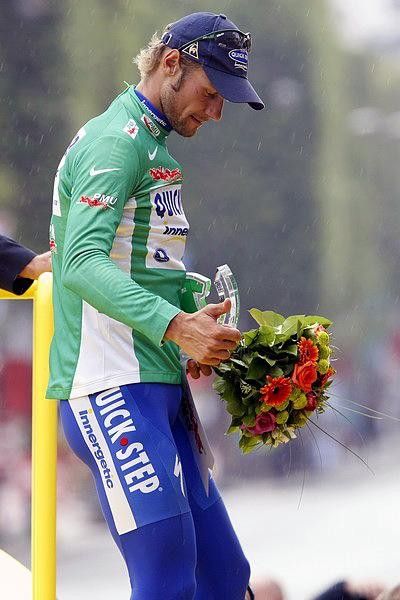 Tom Boonen gets green flowers to go with his jersey.