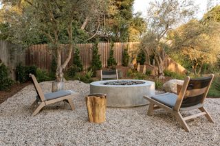 teak outdoor furniture on a gravel garden