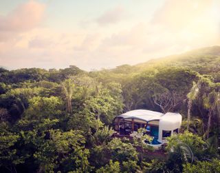 A luxury tent in the middle of the lush jungle at Naviva, a Four Seasons Resort in Mexico