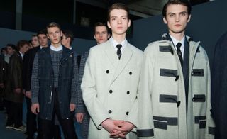 Line up of male models