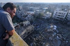A Palestinian man looks a building destroyed in an Israeli airstrike in the Rafah refugee camp in the southern of Gaza Strip on October 16 2023 Israel declared war on the Islamist group Hamas on October 8 a day after waves of its fighters broke through the heavily fortified border and killed more than 1400 people most of them civilians The relentless Israeli bombings since have flattened neighbourhoods and left at least 2670 people dead in the Gaza Strip the majority ordinary Palestinians Photo by MOHAMMED ABED AFP Photo by MOHAMMED ABEDAFP via Getty Images