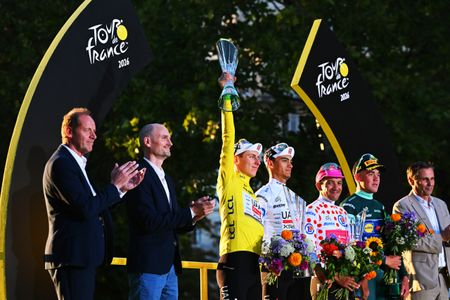 PARIS, FRANCE - JULY 26: (L-R) Tadej Pogacar of Slovenia and - Yellow Leader Jersey, Isaac Del Toro of Mexico and UAE Team Emirates - XRG - White best Young Rider Jersey, Richard Carapaz of Ecuador and Team EF Education - EasyPost - Polka Dot Mountain Jersey and Mads Pedersen of Denmark and Team Lidl - Trek - Green Sprint Jersey celebrate at podium with Christian Prudhomme of France Director of Le Tour de France during the 113th Tour de France 2026, Stage 21 a 89km stage from Paris to Paris / #UCIWT / on July 26, 2026 in Paris, France. (Photo by Tim de Waele/Getty Images)