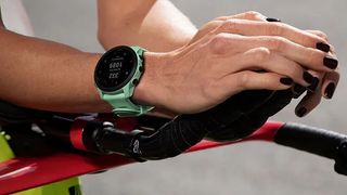 Cyclist wearing Garmin Forerunner 745 watch