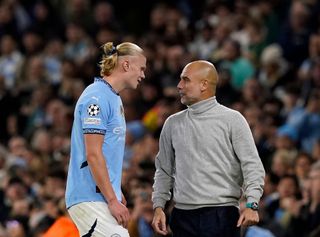 Manchester City's Erling Haaland talks with manager Pep Guardiola during the UEFA Champions League match against Sparta Prague at the Etihad Stadium in Manchester, UK on 23 October, 2024.