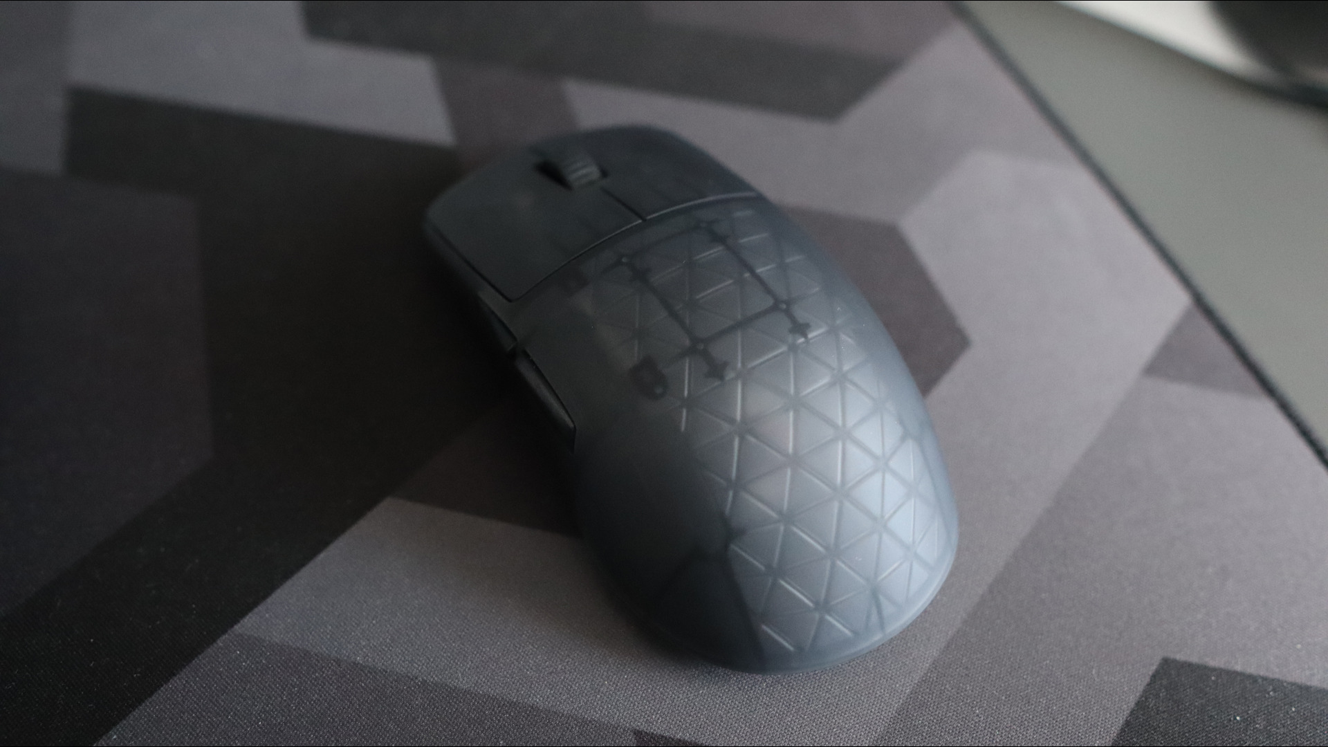 An Endgame Gear OP1w 4K gaming mouse on a desk.