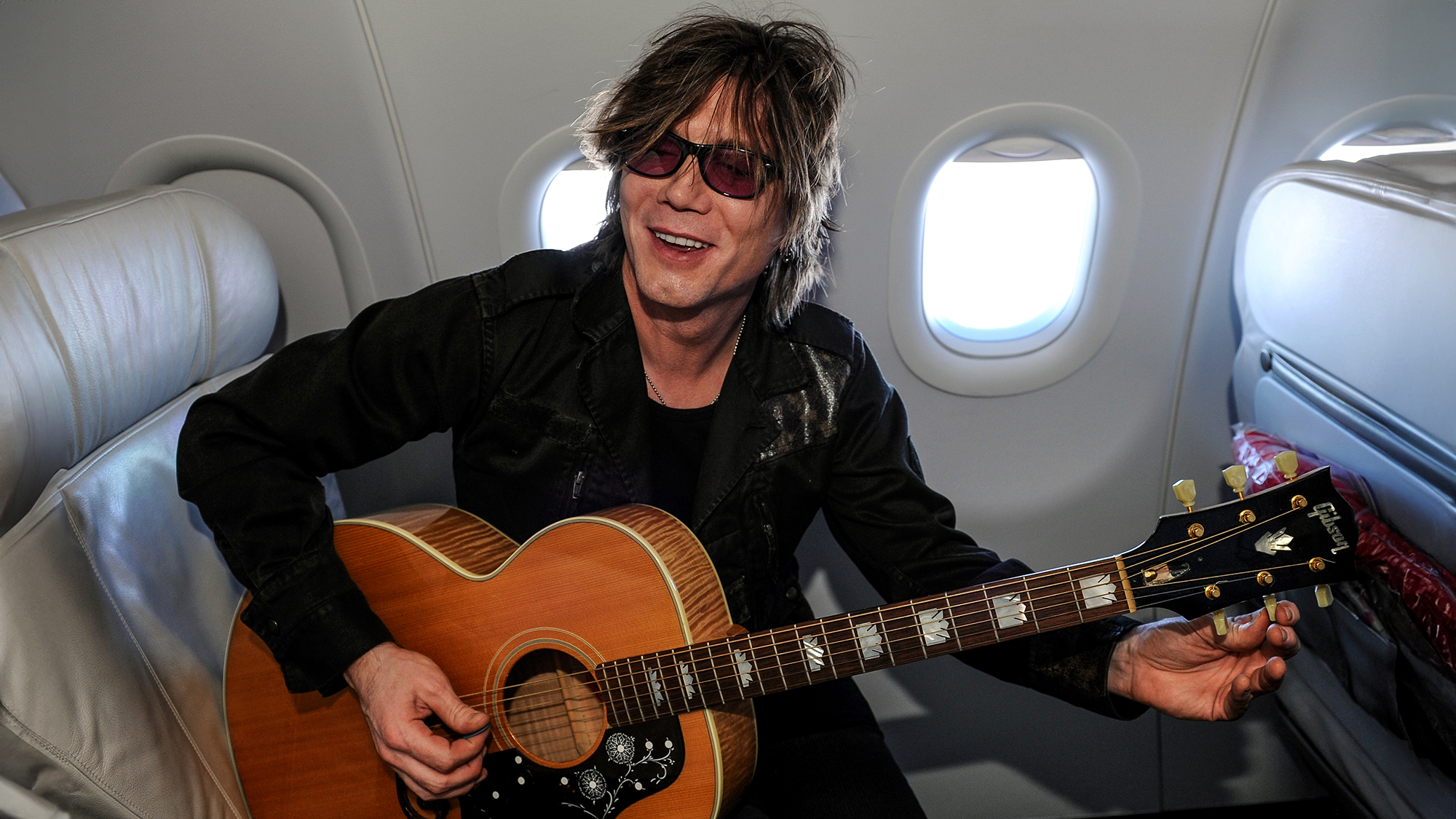 Singer John Rzeznik of the Goo Goo Dolls during a flight to Cancun, Mexico, January 19, 2011 in Los Angeles, California.