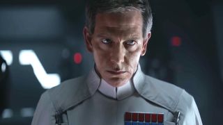 Orson Krennic looks angry as he stares at someone off camera in Rogue One: A Star Wars Story