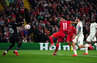 Mohamed Salah (centre) scores Liverpool's second goal