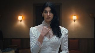 Rachel wears a cut up bridal dress