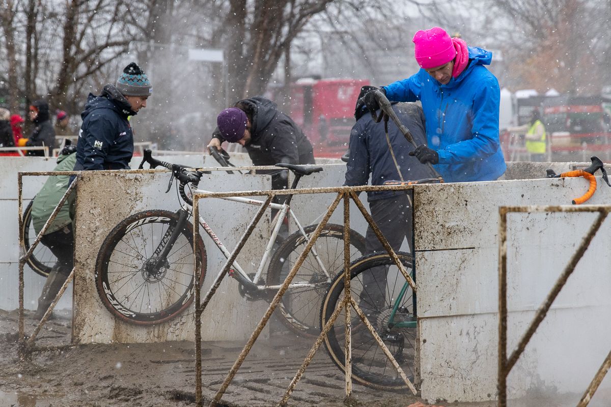The accumulation of snow added moisture to an already muddy and saturated course. Mechanics in the pit were in a mad dash to clean bikes and wheels and get them back to the boxes for the next half lap.