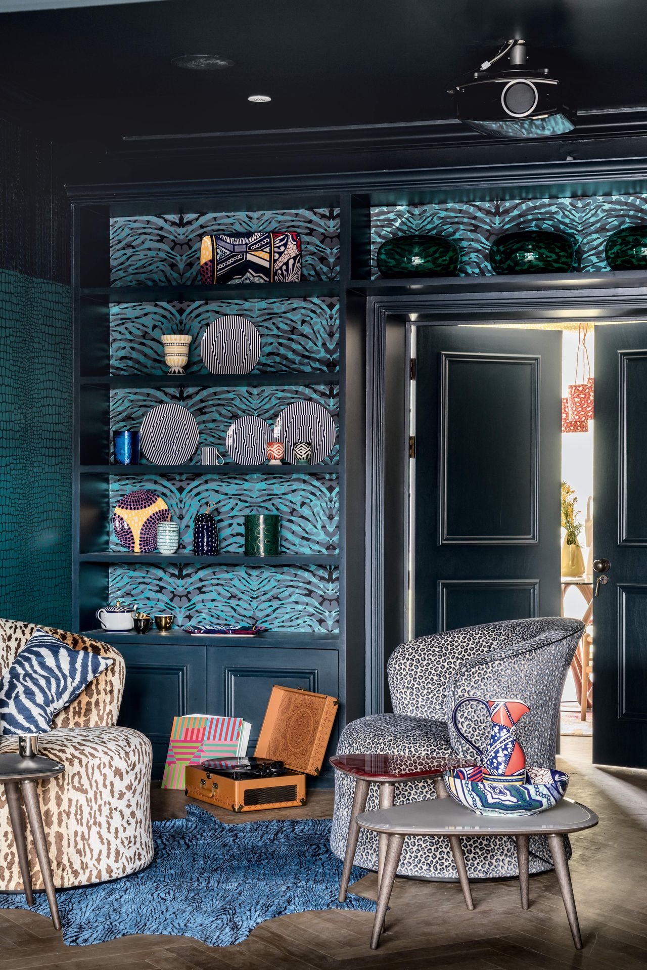 Blue living room with animal print wallpaper