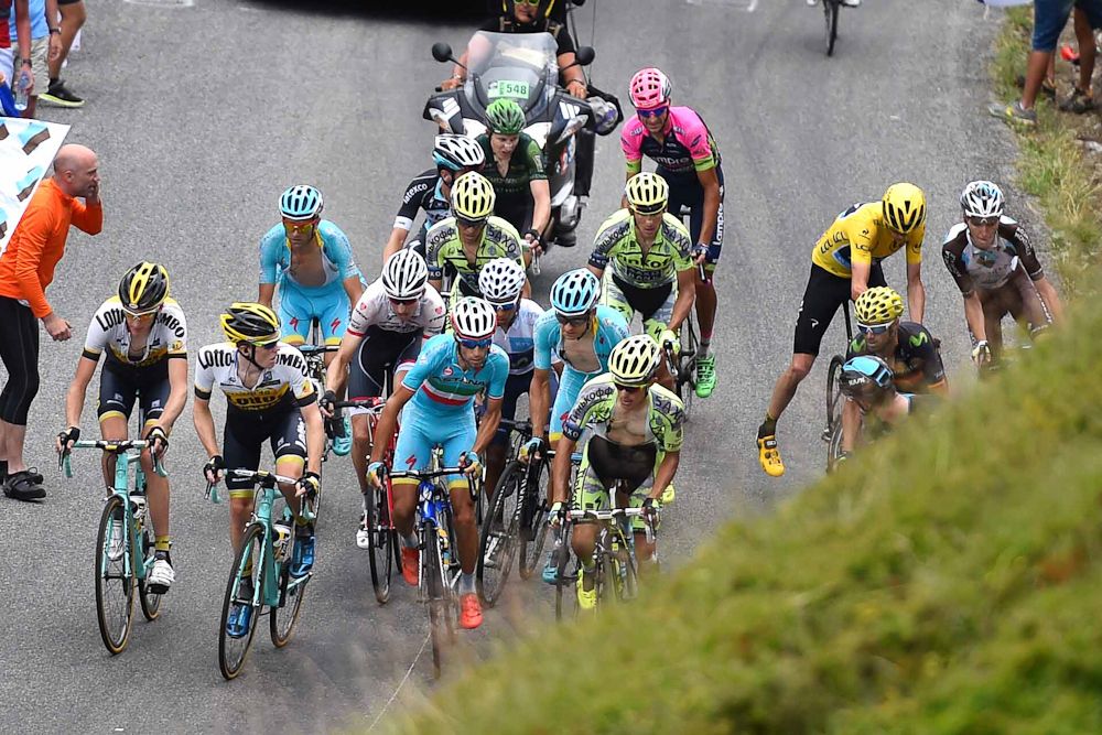 Chris Froome pulls over with a mechanical as Vincenzo Nibali picks up the pace.