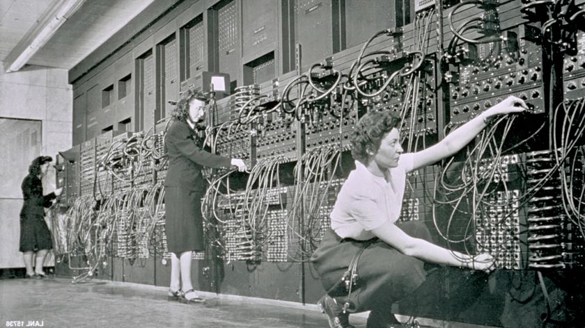 Womem operating an old mainframe