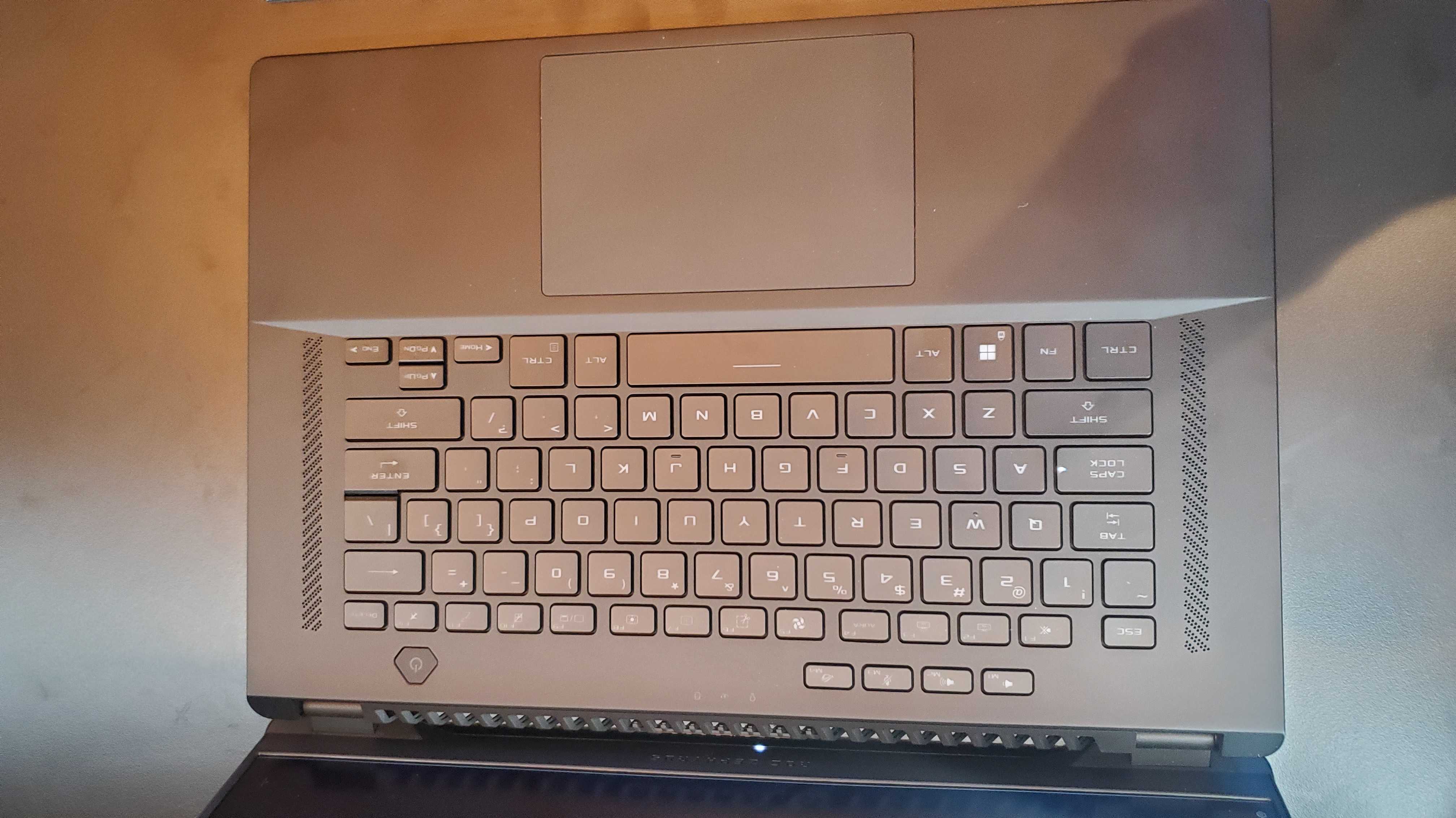 black gaming laptop with lit keyboard